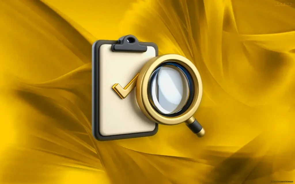 Clipboard with checkmark and magnifying glass