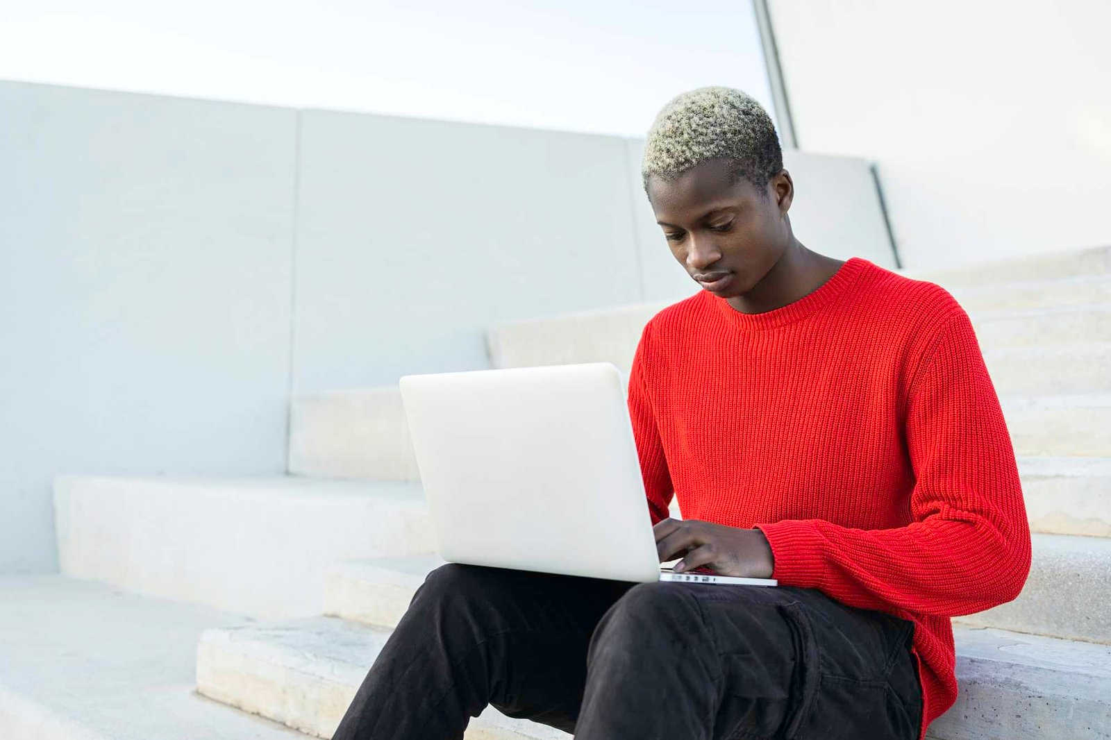 Young African american man with laptop computer.