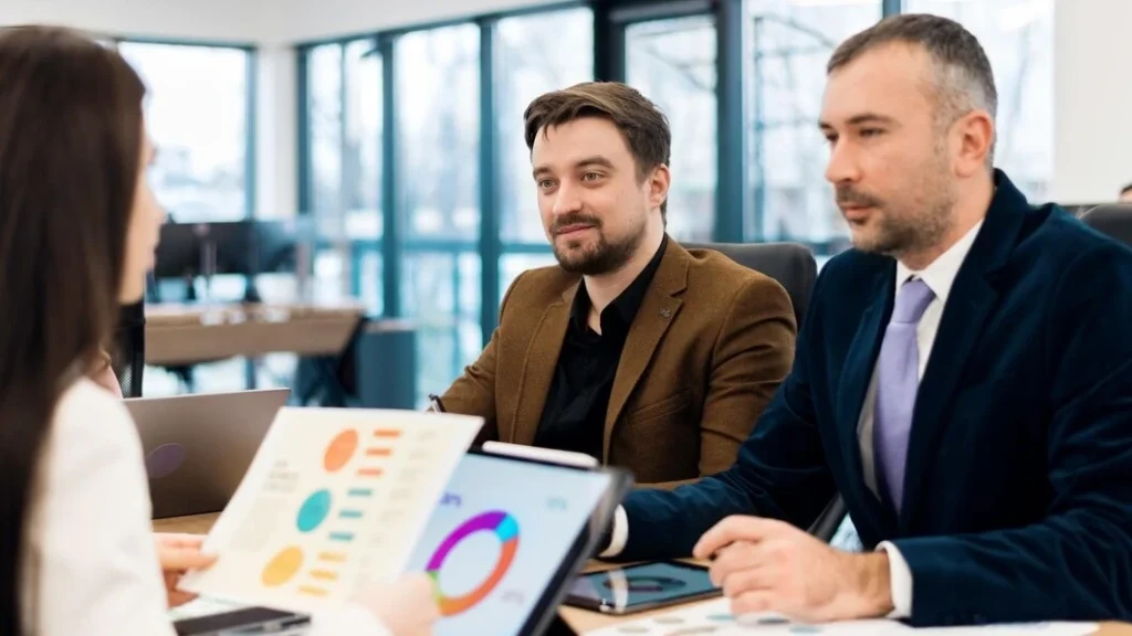Consultants presenting lead generation data to client