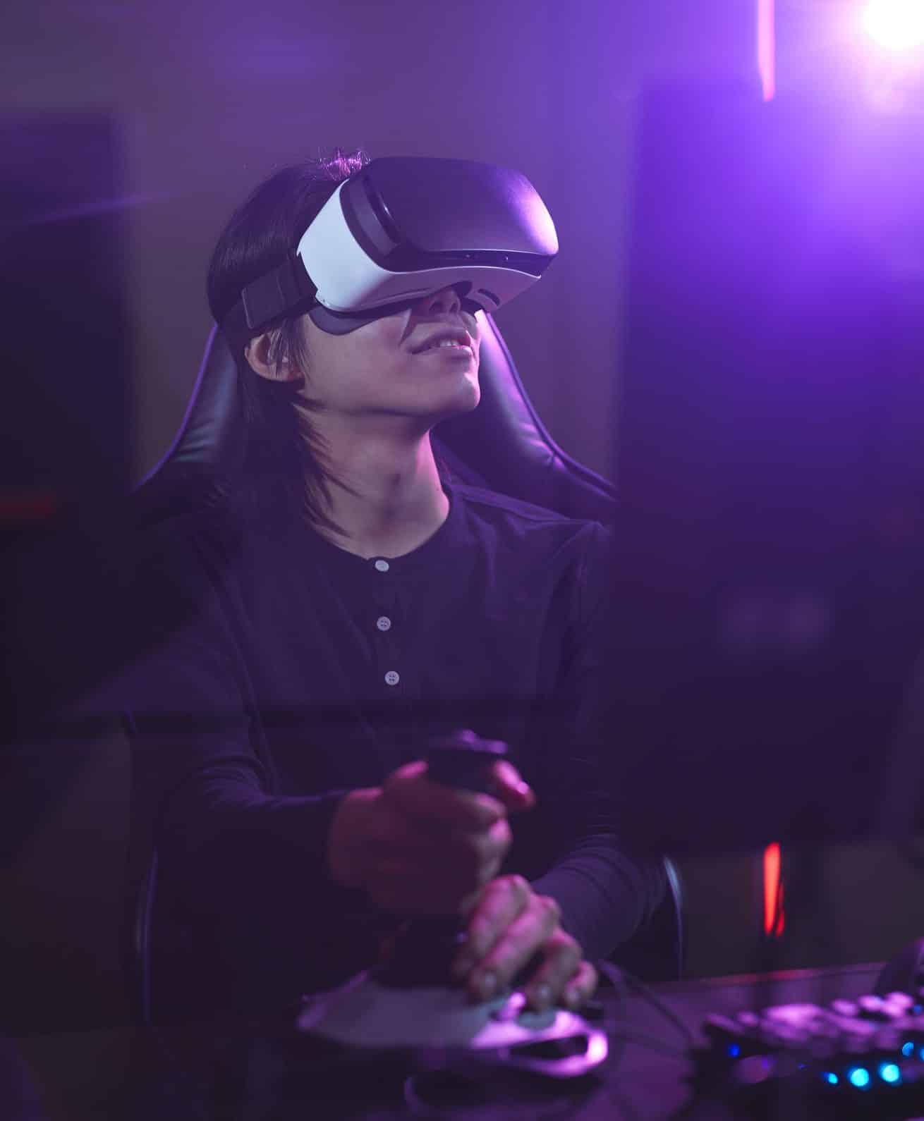 Man Playing VR Video Game in Dark