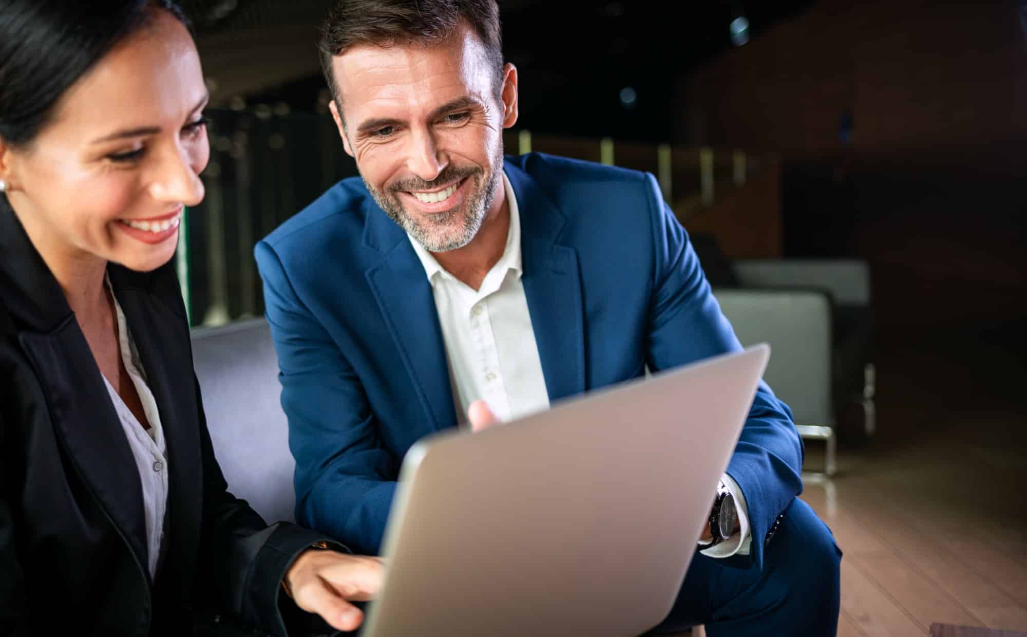 Businessman And Businesswoman Meeting In Modern Office