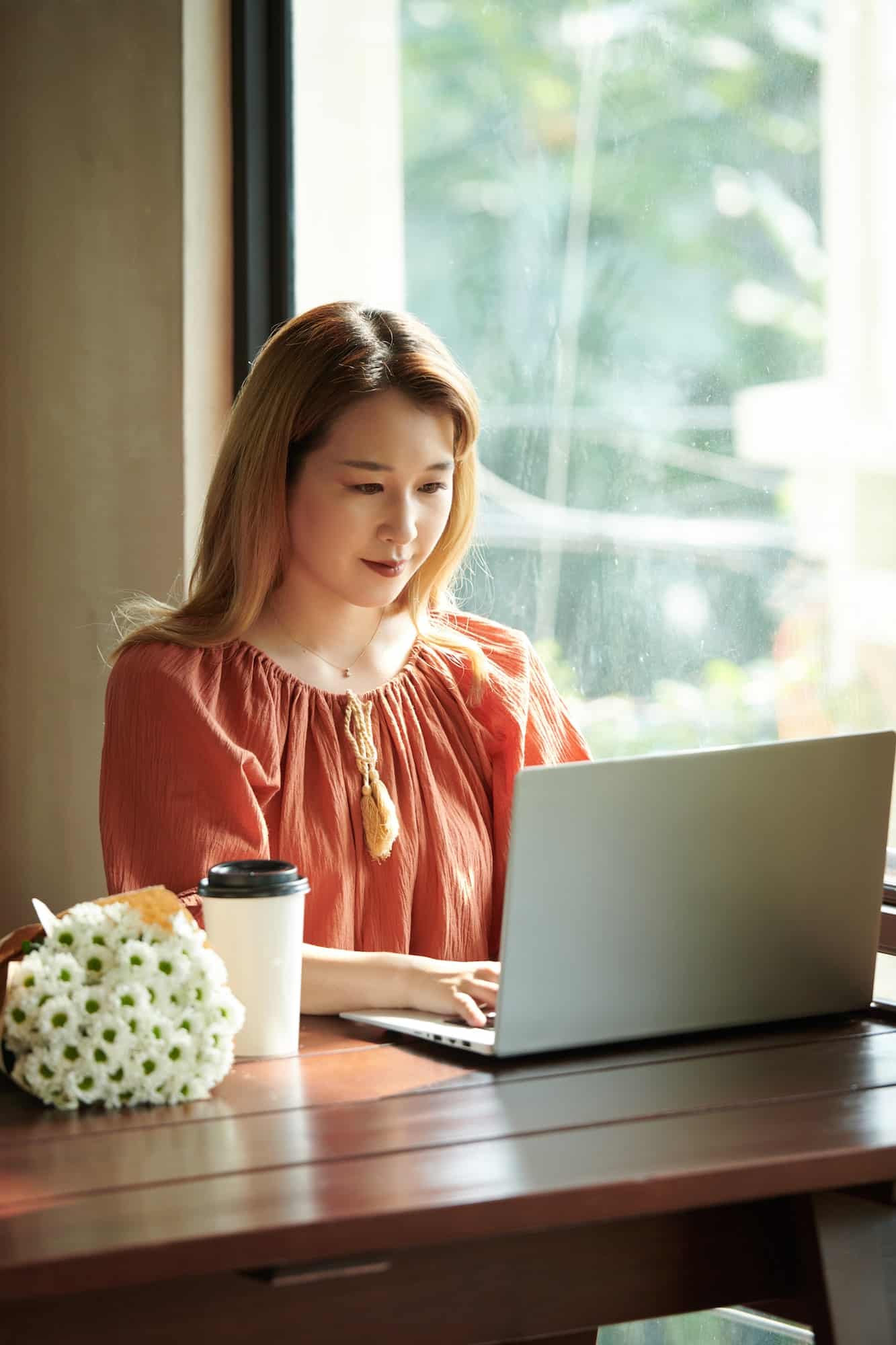 Young Woman Working on Laptop
