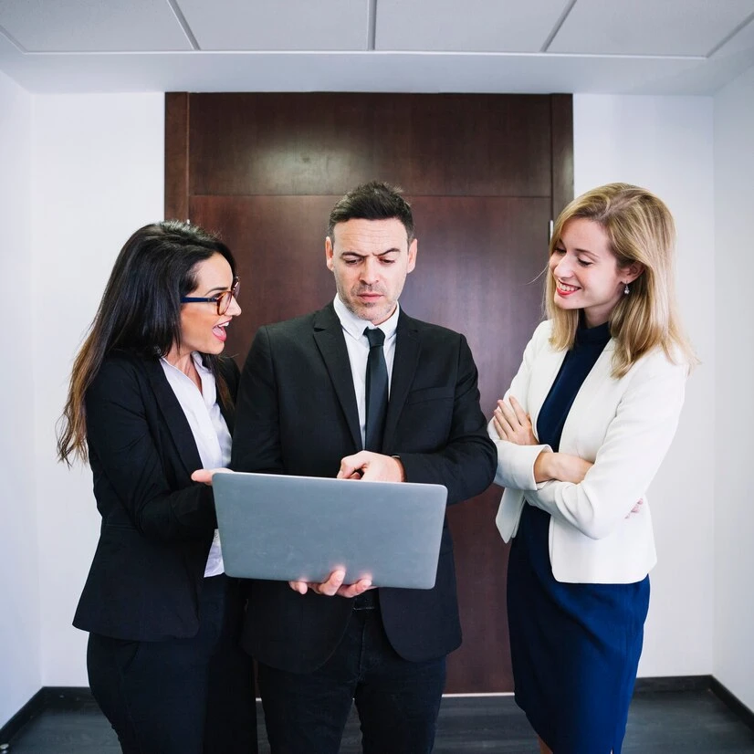Expert HR consultancy services team with laptop in professional London office environment