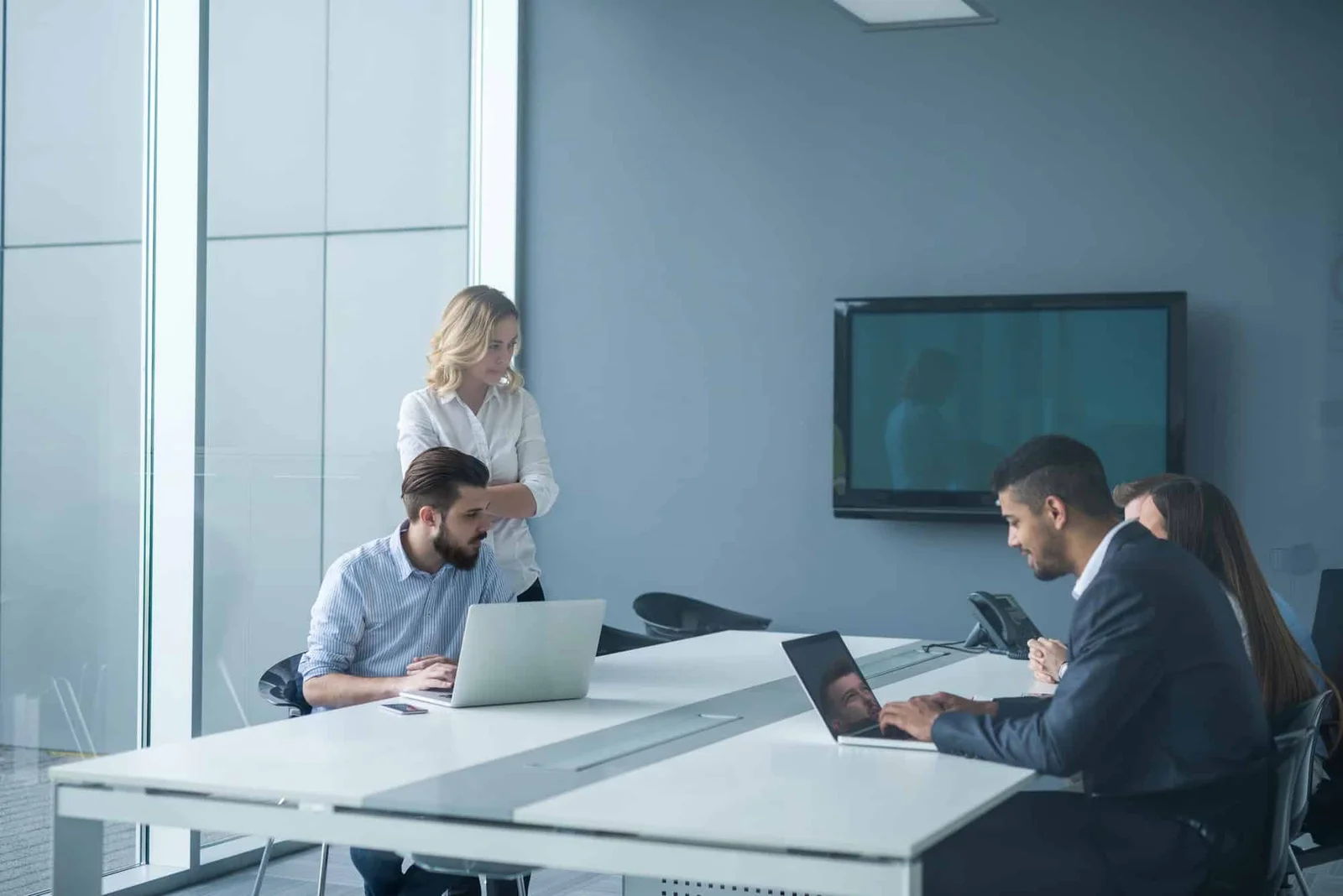 Professional fintech and DeFi consulting team meeting modern conference room