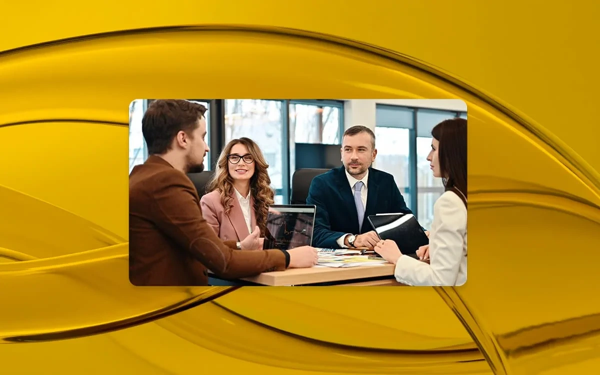 Consultants meeting with clients around table