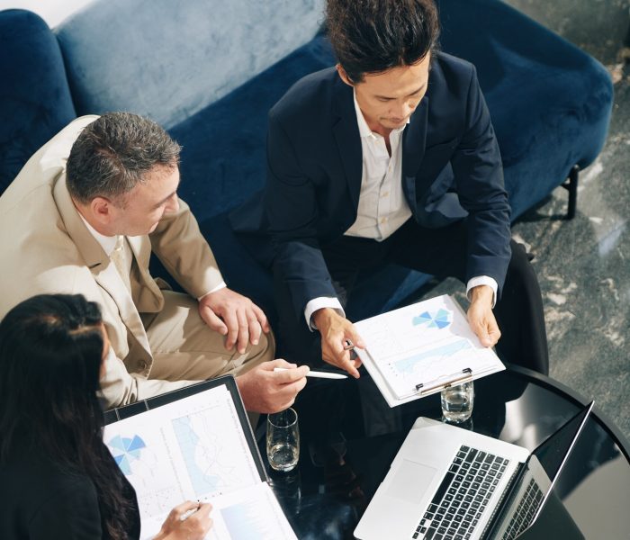 Business partners discussing sales reports
