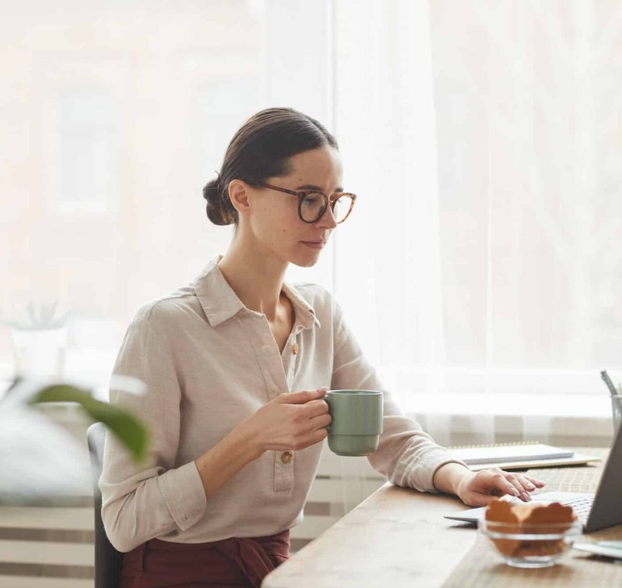 Elegant Woman Using Laptop at Breakfast Elegant Woman Using Laptop at Breakfast
