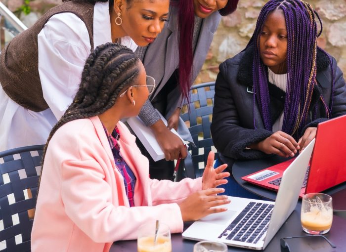 Young businesswomen of black ethnicity. In a business meeting in a cafeteria